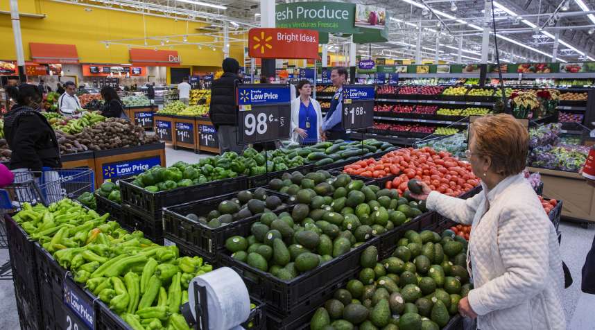 A shopper inspects the fresh produce at a Walmart store in Secaucus, New Jersey, November 11, 2015.