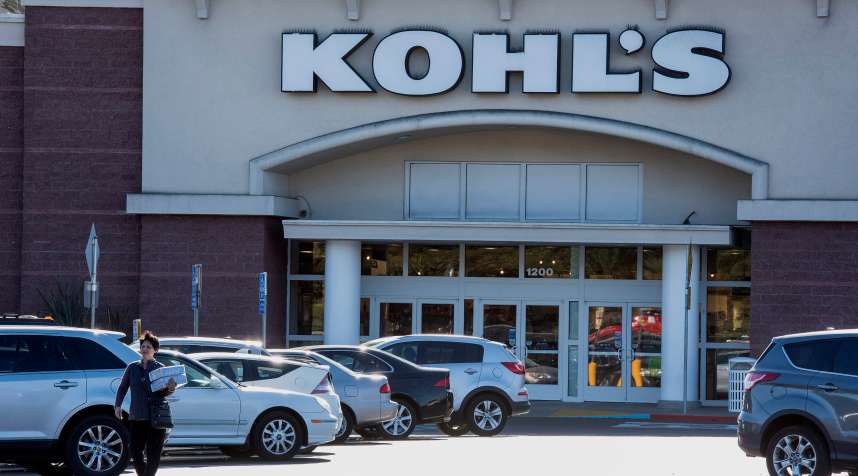 A pedestrian walks in front of a Kohl's Corp. store in Colma, California, U.S., on Tuesday, Feb. 24, 2015.