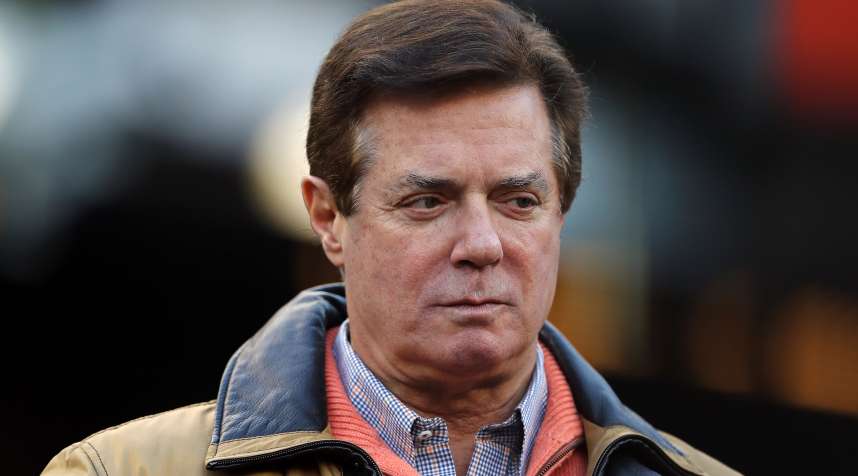 Former Donald Trump presidential campaign manager Paul Manafort looks on during Game Four of the American League Championship Series at Yankee Stadium on October 17, 2017 in the Bronx borough of New York City.