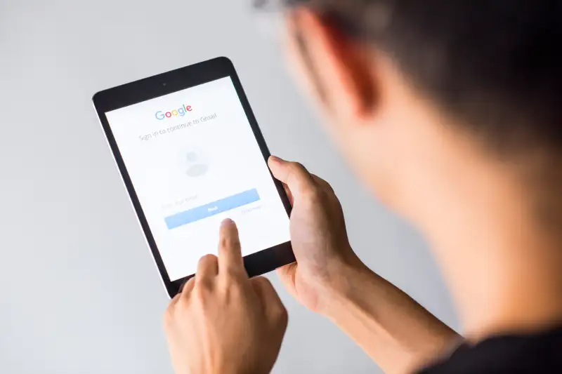A man holds an Apple iPad Mini as he uses Google app in Hong Kong on Oct. 4, 2017.