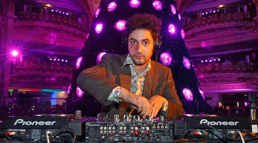 DJ Julio Santo Domingo performs during the Galeries Lafayette 100th Anniversary Bal in Paris, France, circa 2012.