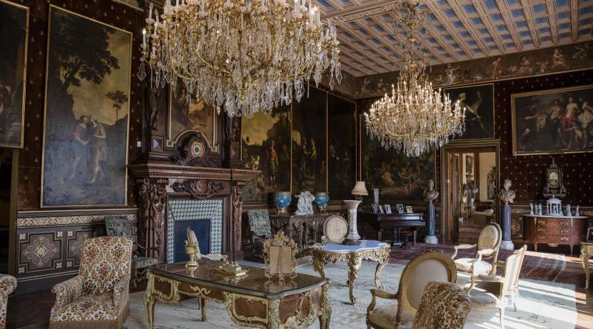 Chandeliers hang over armchairs and tables as 19th century portraits in ornate frames adorn the walls of a sitting room inside the Villa Les Cedres, a 187-year-old, 18,000-square-foot, 14-bedroom mansion set on 35 acres, in Saint-Jean-Cap-Ferrat, France, on Tuesday, Sept. 26, 2017.