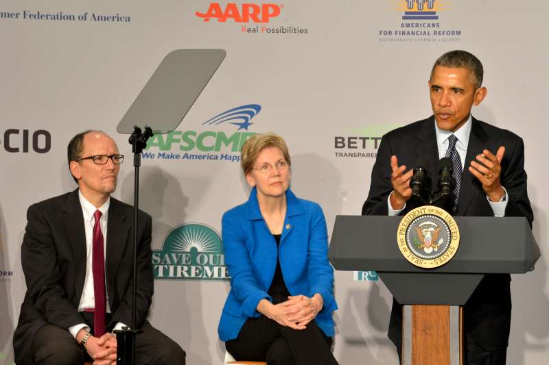President Barack Obama makes remarks as U.S. Sen. Elizabeth Warren and Labor Secretary Tom Perez listen at the AARP,  February 23, 2015 in Washington, DC. Obama joined AARP and members of the  Save Our Retire  coalition in efforts to protect retirement savings from bad investment advice.