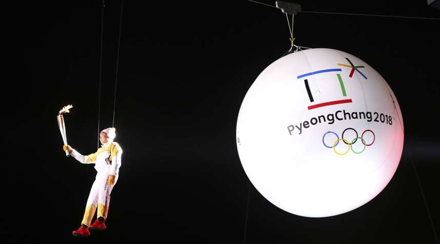 South Korean Ryu Seung-min, a member of the IOC Athletes Commission, carries the Olympic torch as he hangs from a wire during the Olympic Torch Relay in Incheon, South Korea, . The Olympic flame arrived in South Korea Wednesday where it will be passed throughout the country by thousands of torchbearers on a 100-day journey to the opening ceremony of the 2018 Winter Olympics in Pyeongchang
                      Pyeongchang Olympics Flame Arrival, Incheon, South Korea, November 1, 2017.