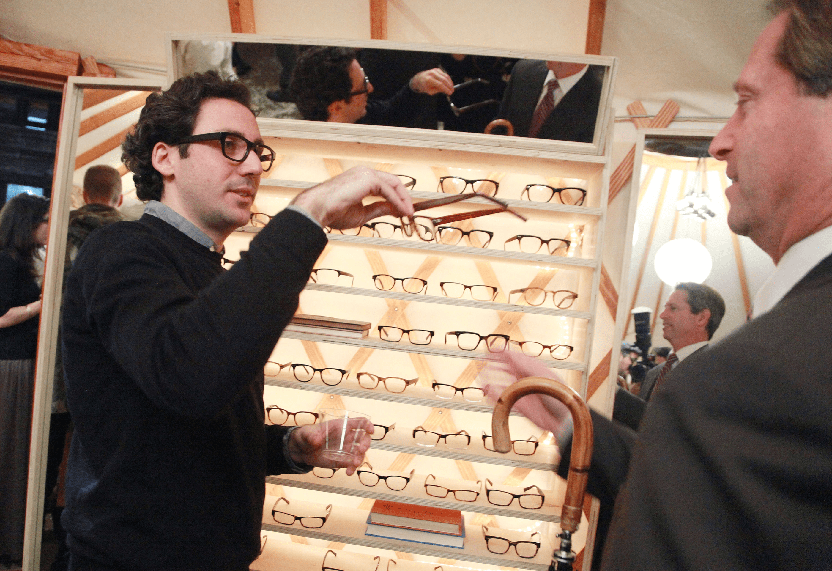 Neil Blumenthal shows Warby Parker optical frames at the Warby Parker's holiday spectacle bazaar - leftover launch on November 29, 2011 in New York City.
