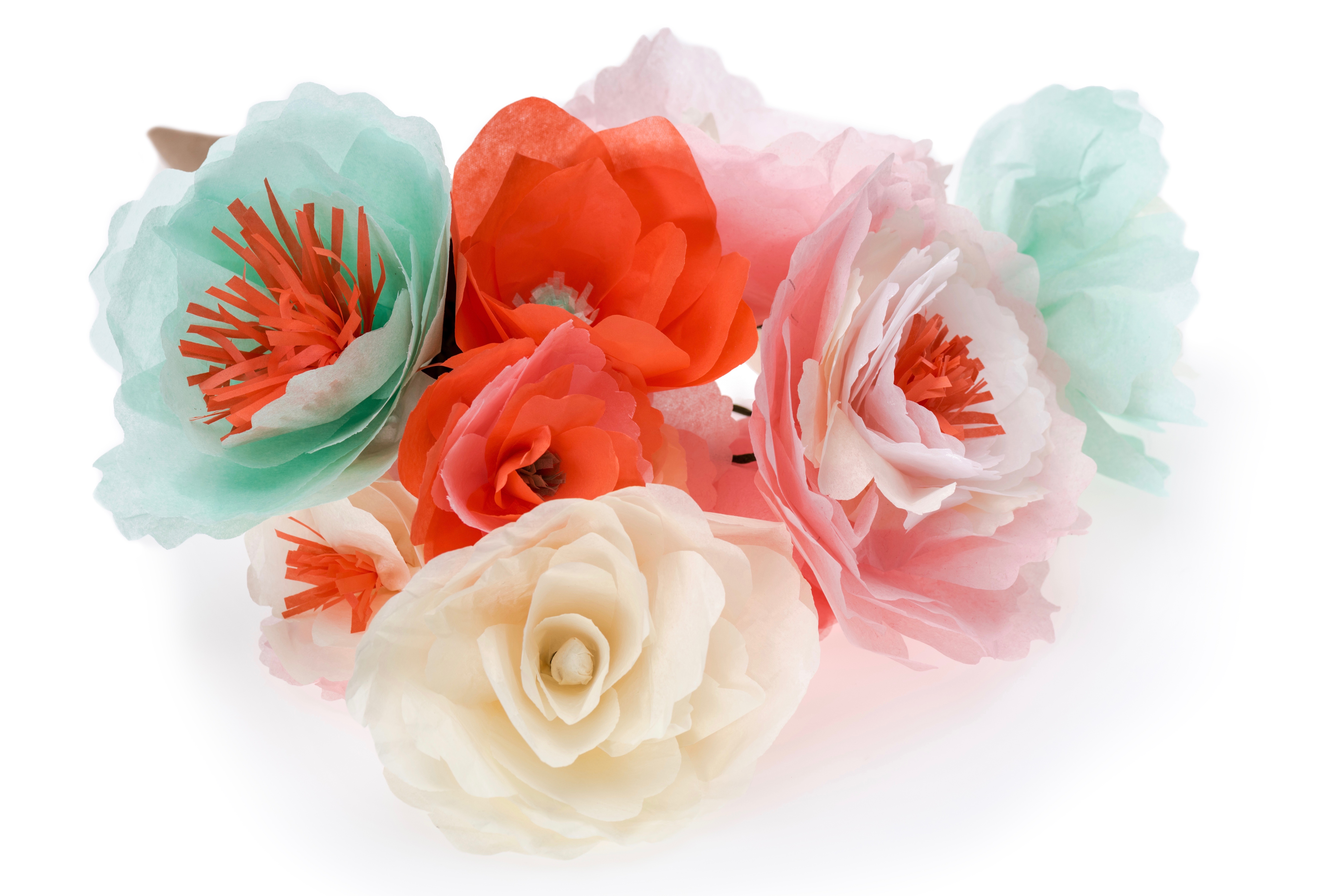 close up view of colorful decorative handmade flowers isolated on white