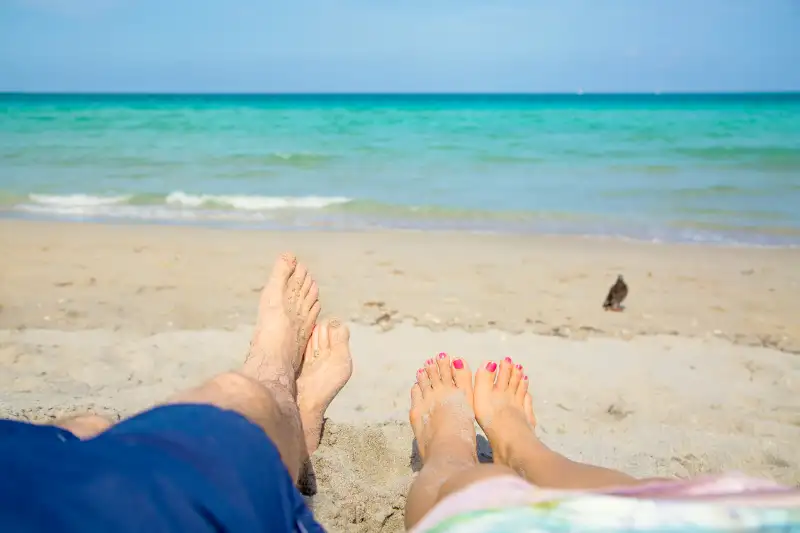 Two feet on the beach