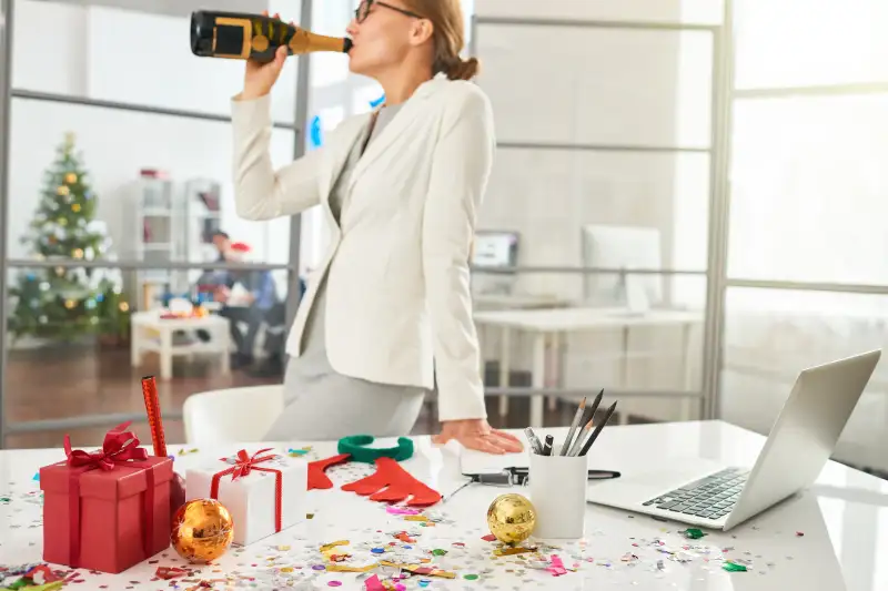 Businesswoman drinking alcohol