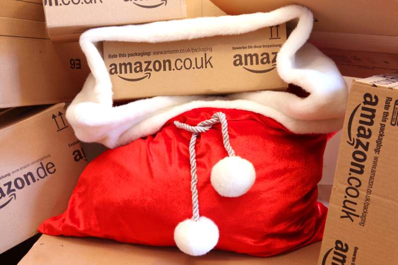 Christmas Shopping Online - Amazon boxes in Red Santa's Sack