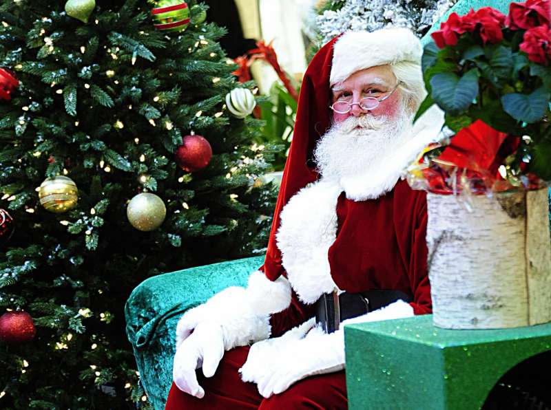 Santa Claus waits to greet children on D