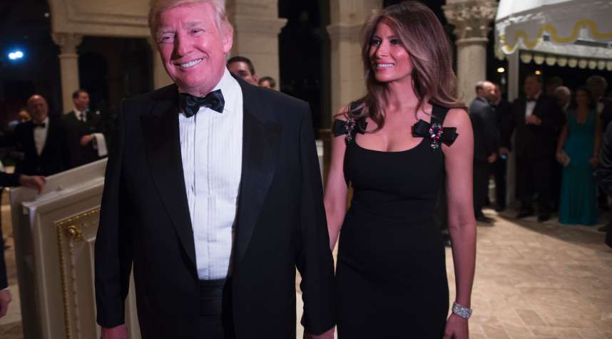 US President-elect Donald Trump arrives with his wife Melania for a New Year's Eve party December 31, 2016 at Mar-a-Lago in Palm Beach, Florida.