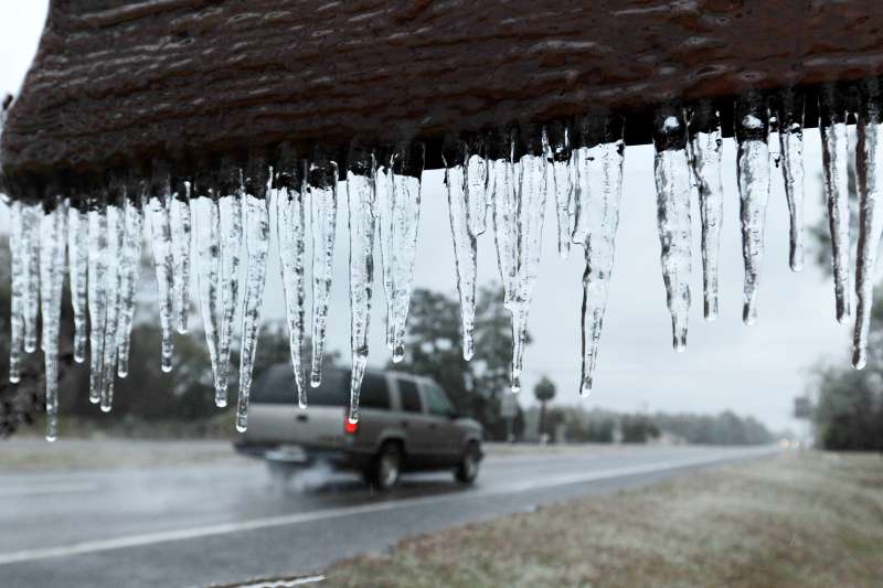 Icicles hang from the  Welcome to Hilliard sign  in Hilliard, Fla., Wednesday, Jan. 3, 2018. A brutal winter storm scattered a wintry mix of snow, sleet and freezing rain from normally balmy Florida up the Southeast seaboard Wednesday. (Bob Self/The Florida Times-Union via AP)