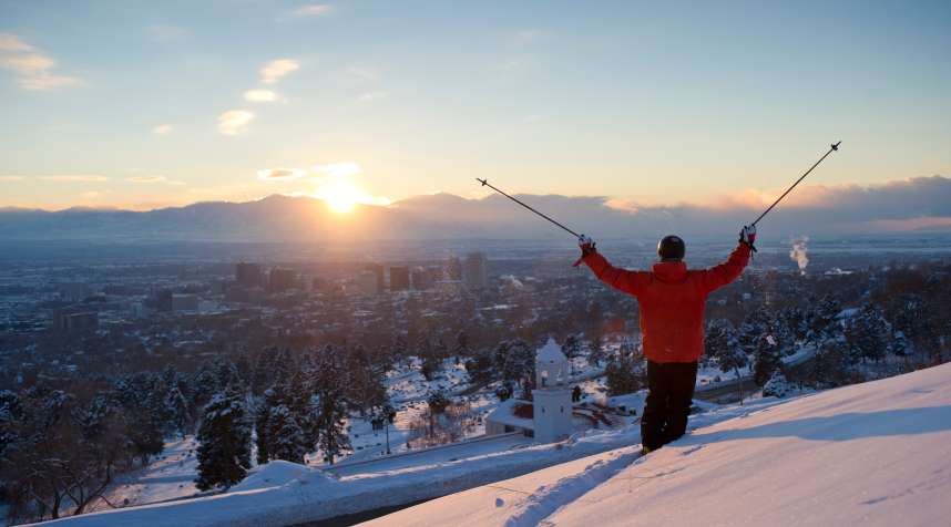 Man skiing in the avenues above Salt Lake City, Utah.