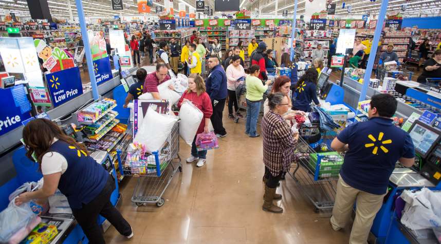 Walmart customers checkout at the retailer's Black Friday event with big savings on hundreds of top items on Thursday, Nov. 26, 2015 in Rogers, Ark.