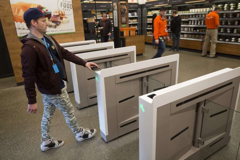 An Amazon.com Inc. employee scans in to shop at the Amazon Go store in Seattle, Washington, on January 17, 2018.