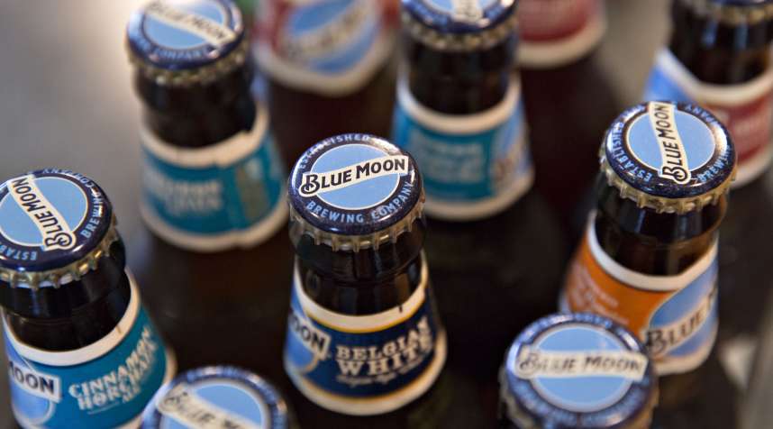 Bottles of Molson Coors Brewing Co. Blue Moon brand beer are arranged for a photograph in Princeton, Illinois, U.S., on Wednesday, Oct. 26, 2016. Molson Coors Brewing Co. is scheduled to release earnings figures on November 1.