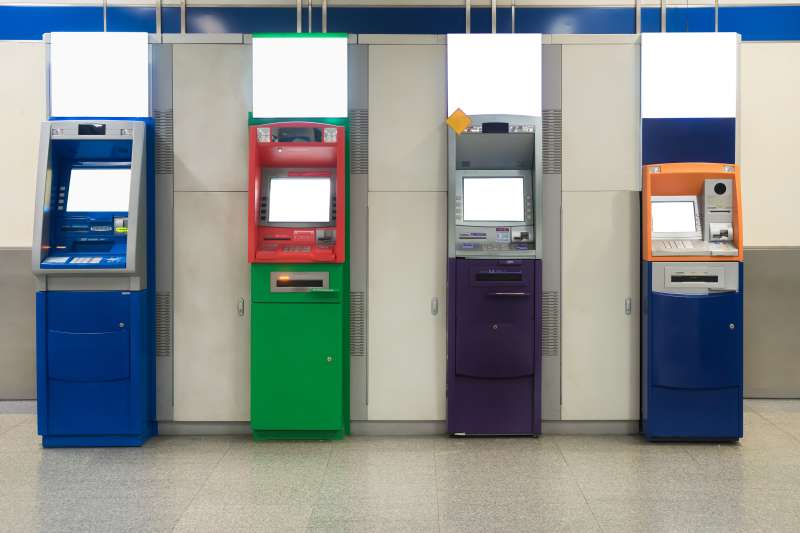 Automatic withdrawal device machine in subway. Colorful ATM machine.