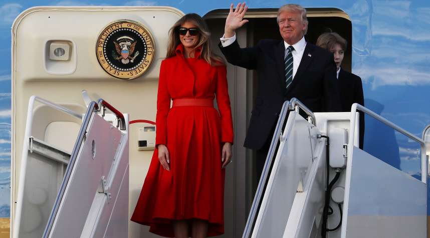 President Donald Trump, his wife Melania Trump and their son Barron Trump arrive together on Air Force One at the Palm Beach International Airport to spend part of the weekend at Mar-a-Lago resort on March 17, 2017 in West Palm Beach, Florida