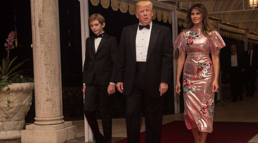 U.S. President Donald Trump, First Lady Melania Trump and their son Barron arrive for a new year's party at Trump's Mar-a-Lago resort in Palm Beach, Florida, on December 31, 2017.