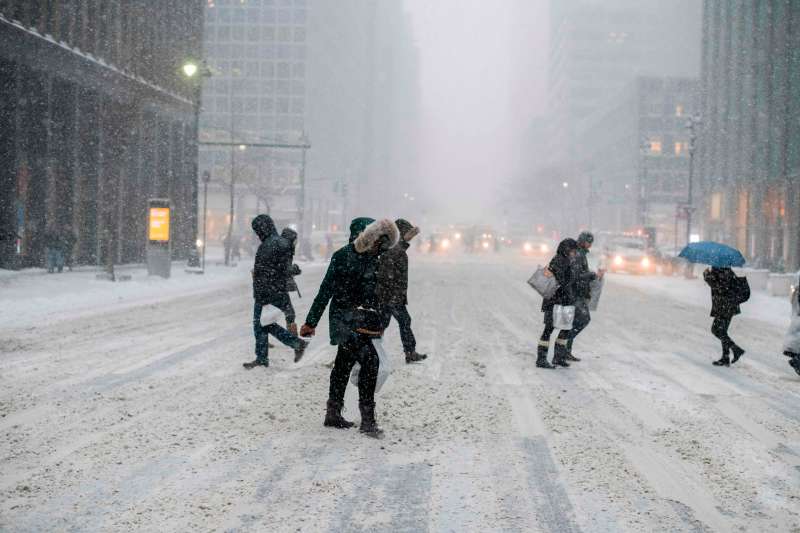 People make their way during a winter storm in New York on January 4, 2018. 
            
            
            The US National Weather Service warned that a major winter storm would bring heavy snow and ice, from Florida in the southeast up to New England and the Northeast on Wednesday and Thursday / AFP PHOTO / Jewel SAMAD        (Photo credit should read JEWEL SAMAD/AFP/Getty Images)