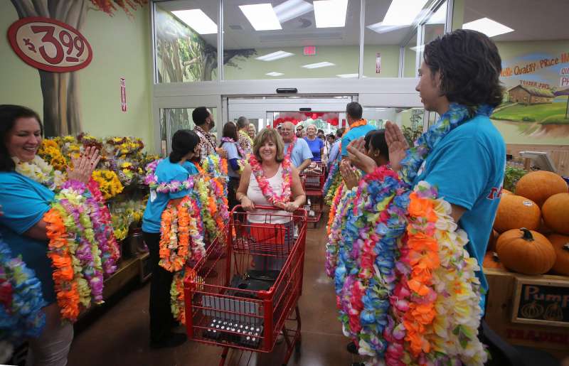 Sept. 19, 2014 - Florida, U.S. - Robin Gallo (center) of North Palm Beach attended the opening on the new Trader Joe's store in Palm Beach Gardens store Friday, September 19, 2014. ''I got here at 6am and was the first in line, '' she said. ''I am using h
