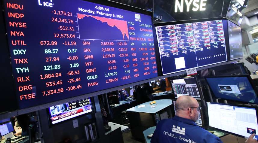 A trader works at the New York Stock Exchange in New York, the United States, on Feb. 5, 2018. U.S. stocks closed sharply lower on Monday, with the Dow plummeting 4.60 percent, as the market took a heavy hit from panic sales.