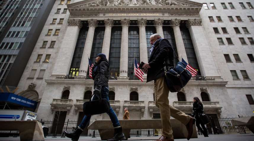 Pedestrians pass in front of the New York Stock Exchange (NYSE) in New York, on Feb. 6, 2018. U.S. equity indexes climbed higher after a rocky start, and the benchmark gauge for U.S. share volatility reversed course after hitting a two-year high.
