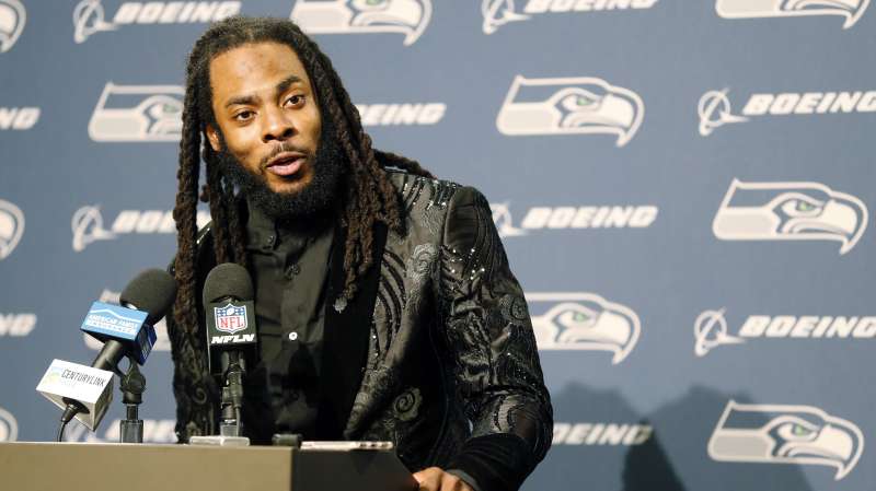 Seattle Seahawks cornerback Richard Sherman talks to reporters during a post-game press conference following an NFL football game against the Houston Texans, in Seattle, October 29, 2017.
