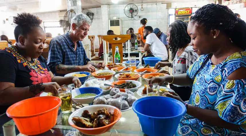 Anthony Bourdain in “Anthony Bourdain: Parts Unknown” Season 10 having lunch with food blogging trio in Lagos, April 2017.