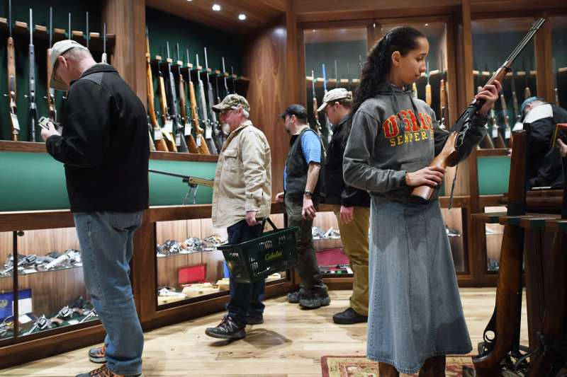 Customers shop in in the gun library room at a Cabela's store in Virginia.