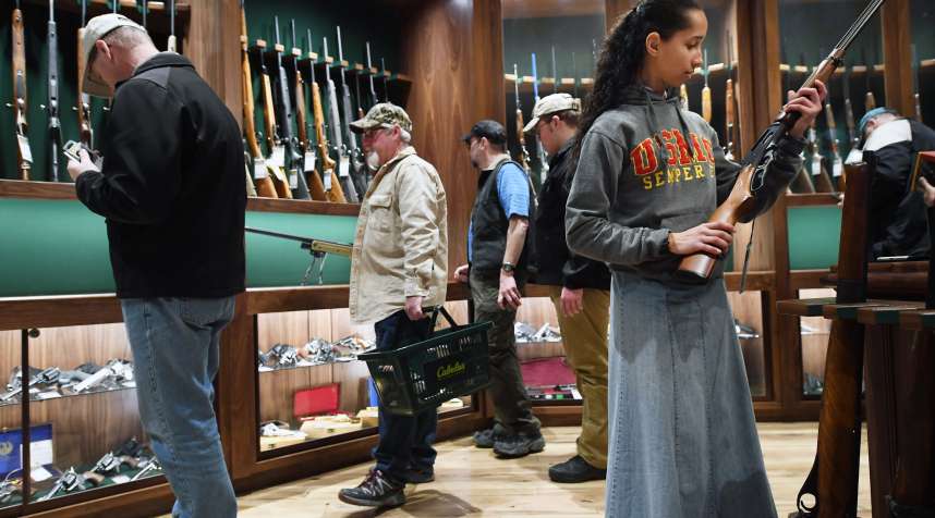 Customers shop in in the gun library room at a Cabela's store in Virginia.