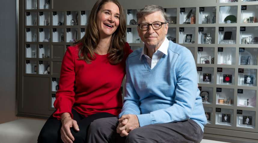 Bill Gates and Melinda Gates pose for a portrait in their personal office