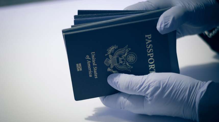 Unrecognizable person, having american passport for inspection