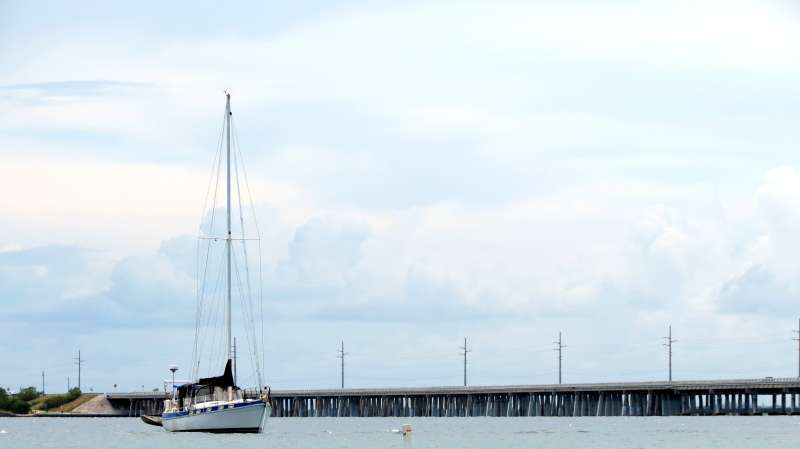 Sailboats Moored At Harbor Against Sky