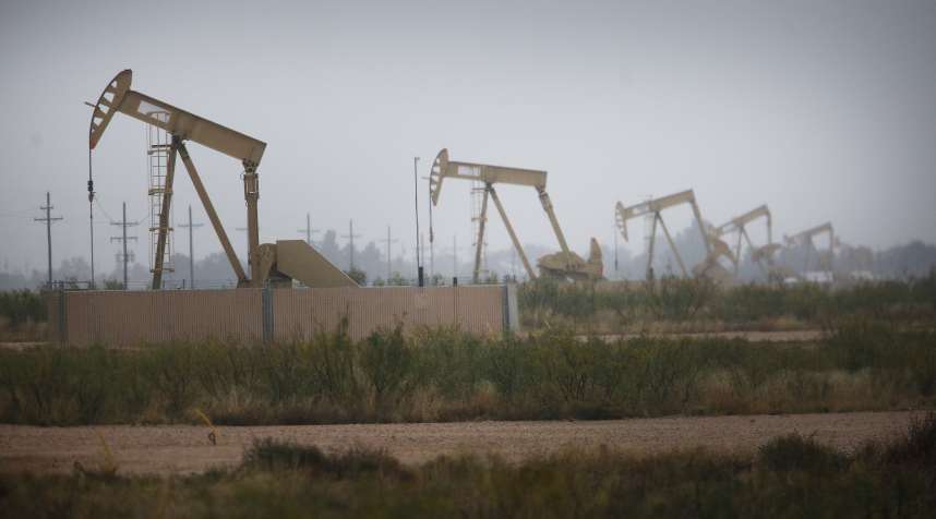 Electric oil pump jacks stand in the oil fields surrounding Midland, Texas, U.S., on Wednesday, Nov. 8, 2017.