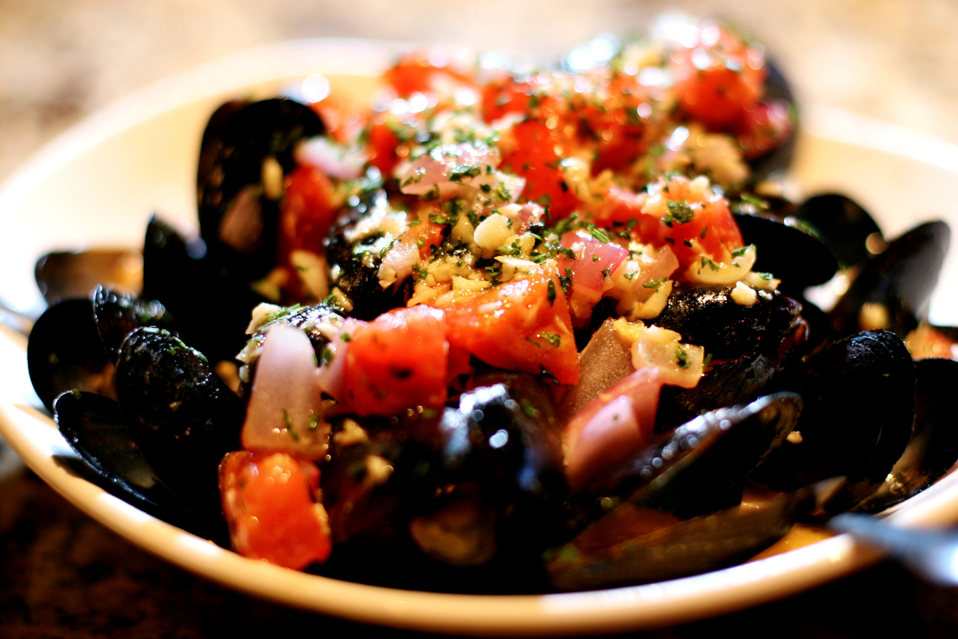 Mussels Josephine; tomatoes, garlic, basil - lemon wine sauce at Bonefish Grill in Boynton Beach.