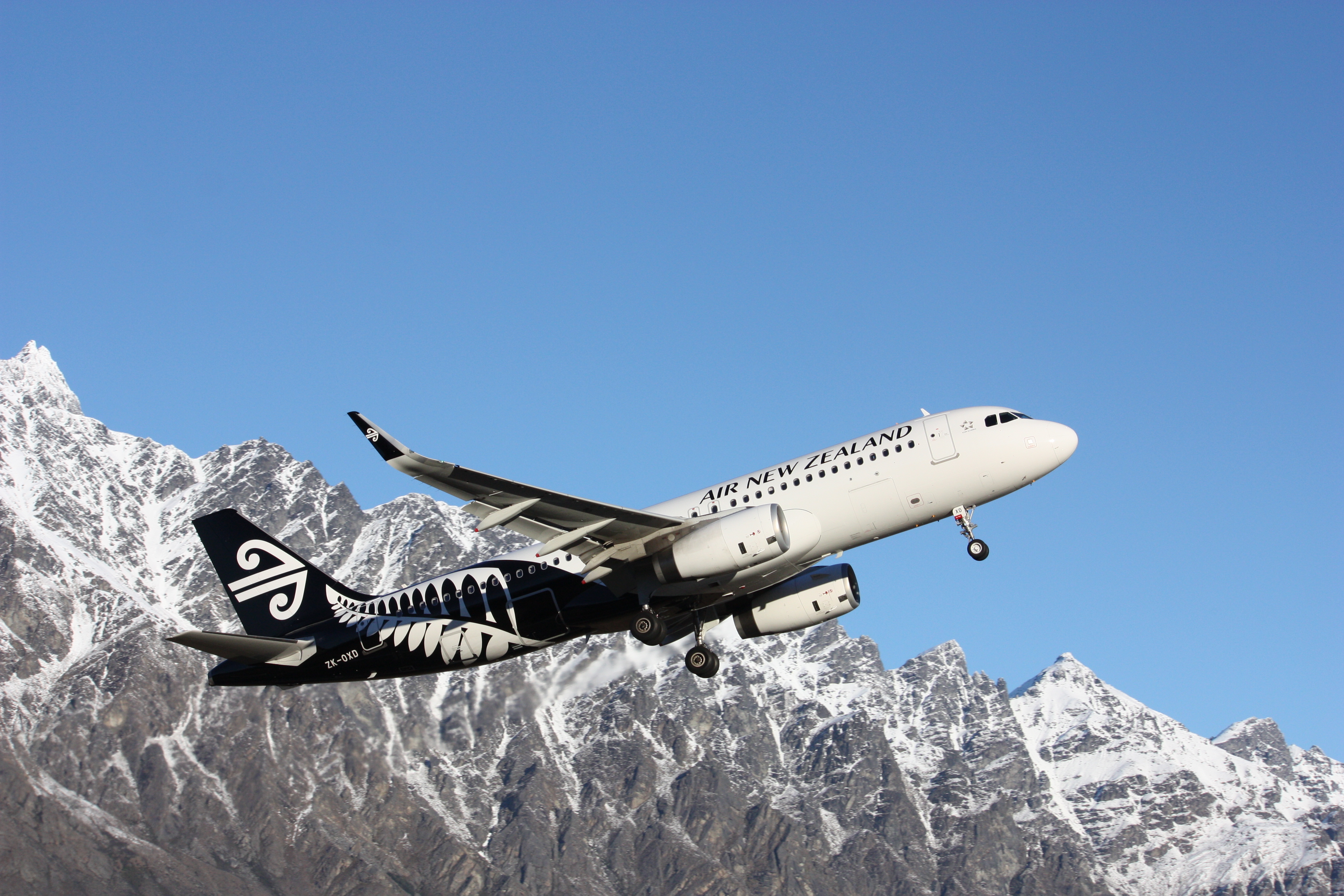 Airplane Air New Zealand take-off from Queenstown, August 16, 2014.