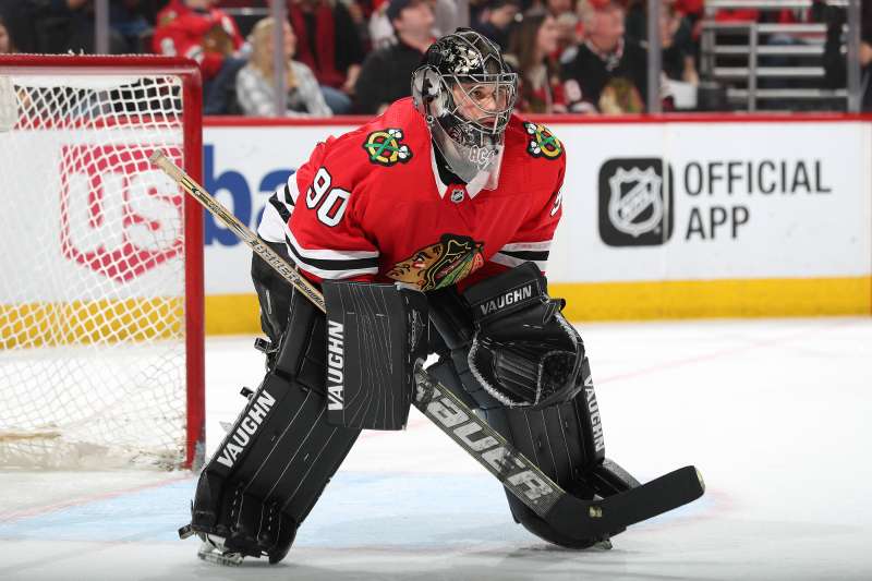 Goalie Scott Foster #90 of the Chicago Blackhawks guards the net in the third period against the Winnipeg Jets at the United Center on March 29, 2018 in Chicago, Illinois.