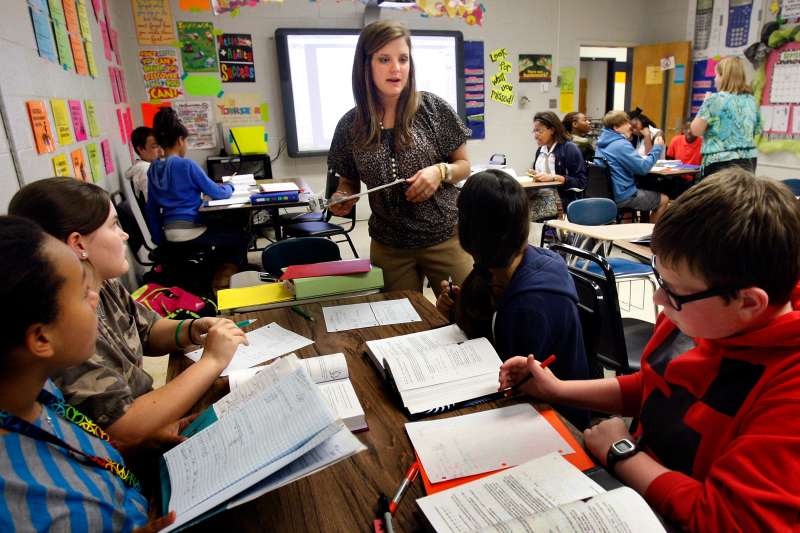 Hannah Wren works with her seventh grade math students at Olive Branch Middle School.