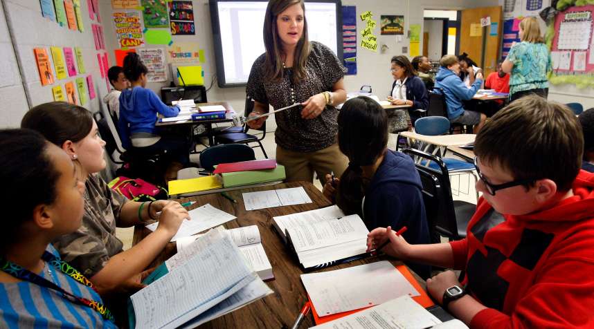 Hannah Wren works with her seventh grade math students at Olive Branch Middle School.