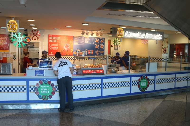 Travelers grabbing a bite to eat inside of LaGuardia Airport on December 20, 2015 in New York City.