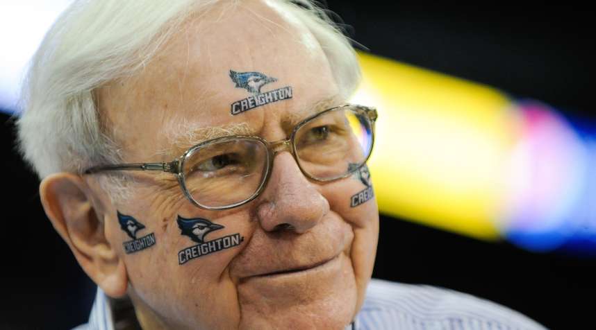 Warren Buffett of Berkshire Hathaway poses for pictures before the game between the Creighton Bluejays and the Providence Friars at CenturyLink Center on March 8, 2014 in Omaha, Neb.
