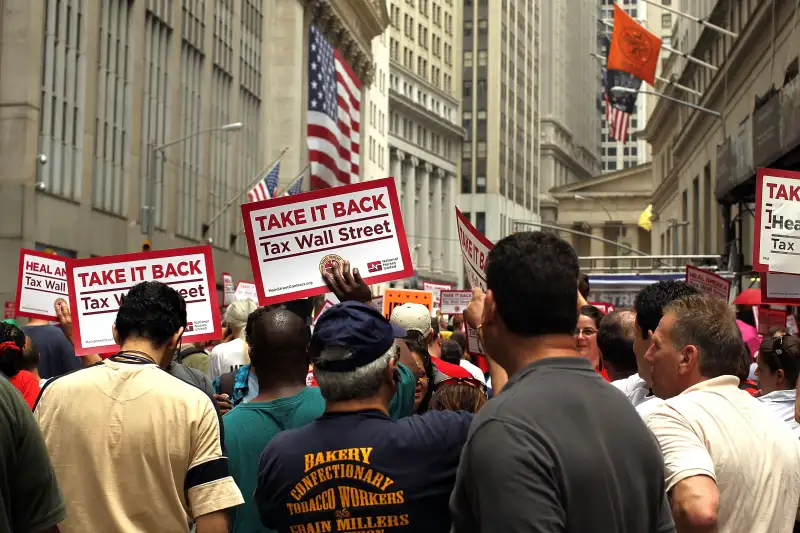 Activists March On Wall Street To Hold Institutions Accountable For Financial Global Crisis