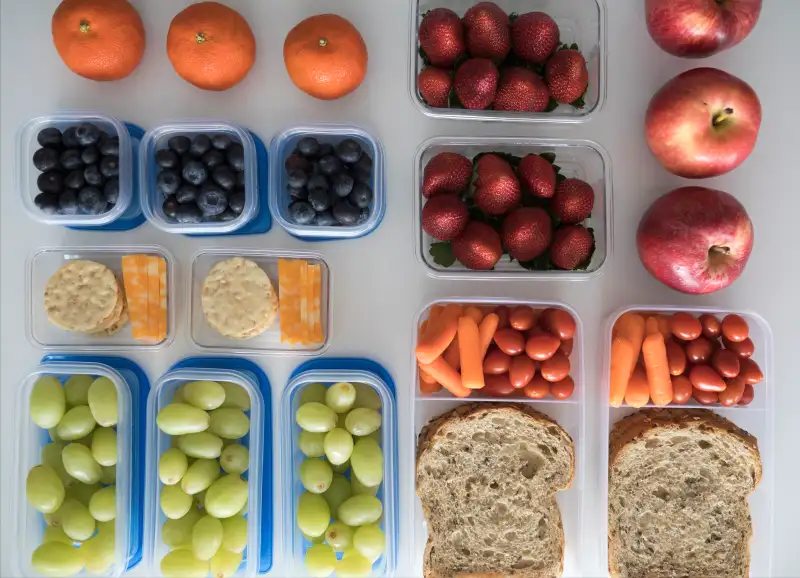Overhead view prepared healthy snacks and lunches in containers