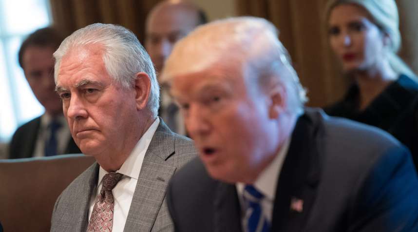 Secretary of State Rex Tillerson listens as President Donald Trump speaks during a cabinet meeting at the White House on November 20, 2017.