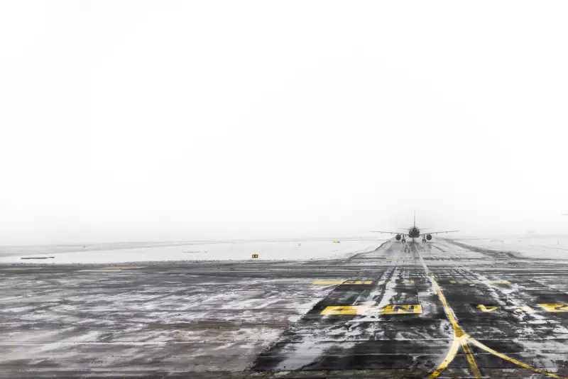 Plane taking off in to dense fog