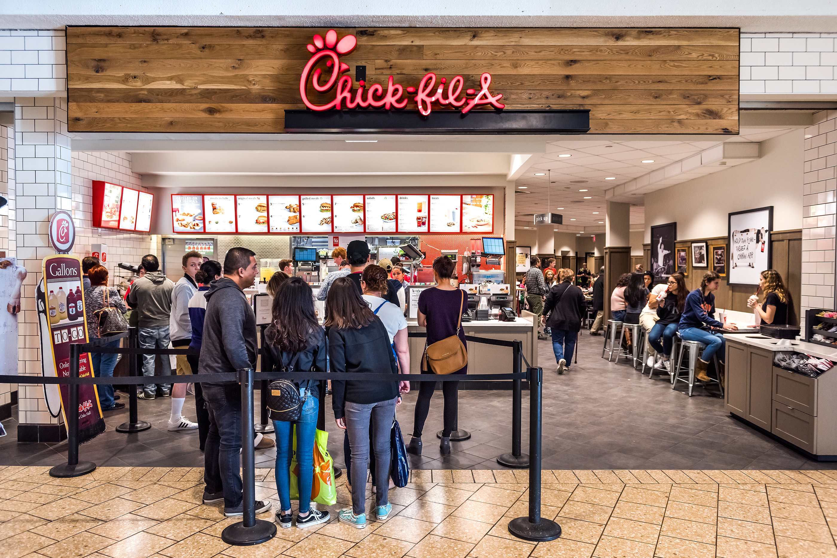Chick-fil-a store with people in line waiting to buy food, Fairfax, Virginia, Feburary 18, 2017.