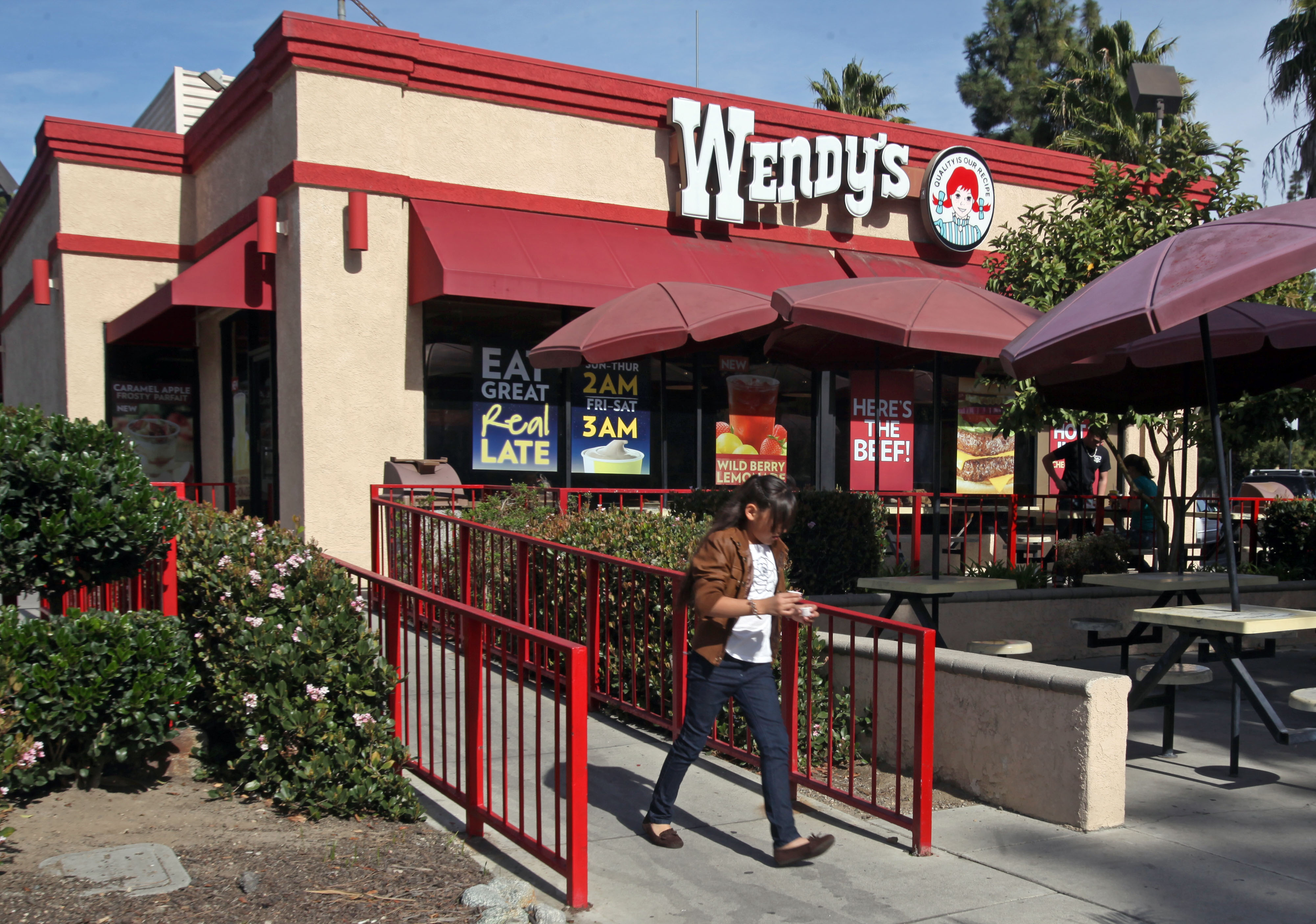 A customer leaves a Wendy's restaurant in Los Angeles.