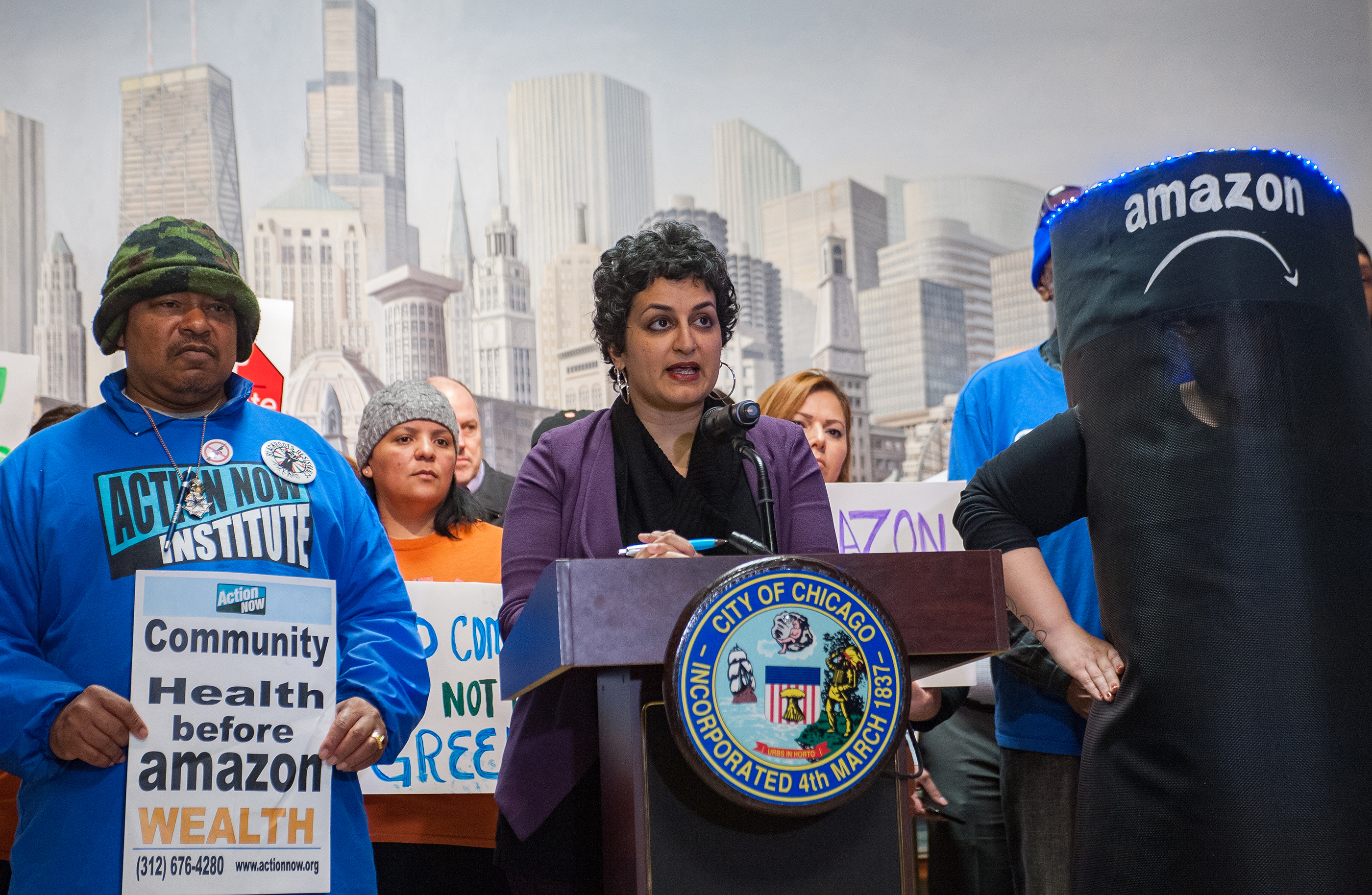 Amisha Patel, Executive Director of Grassroots Collaborative addresses crowd at Press Conference in Chicago City Hall, April 11, 2018.