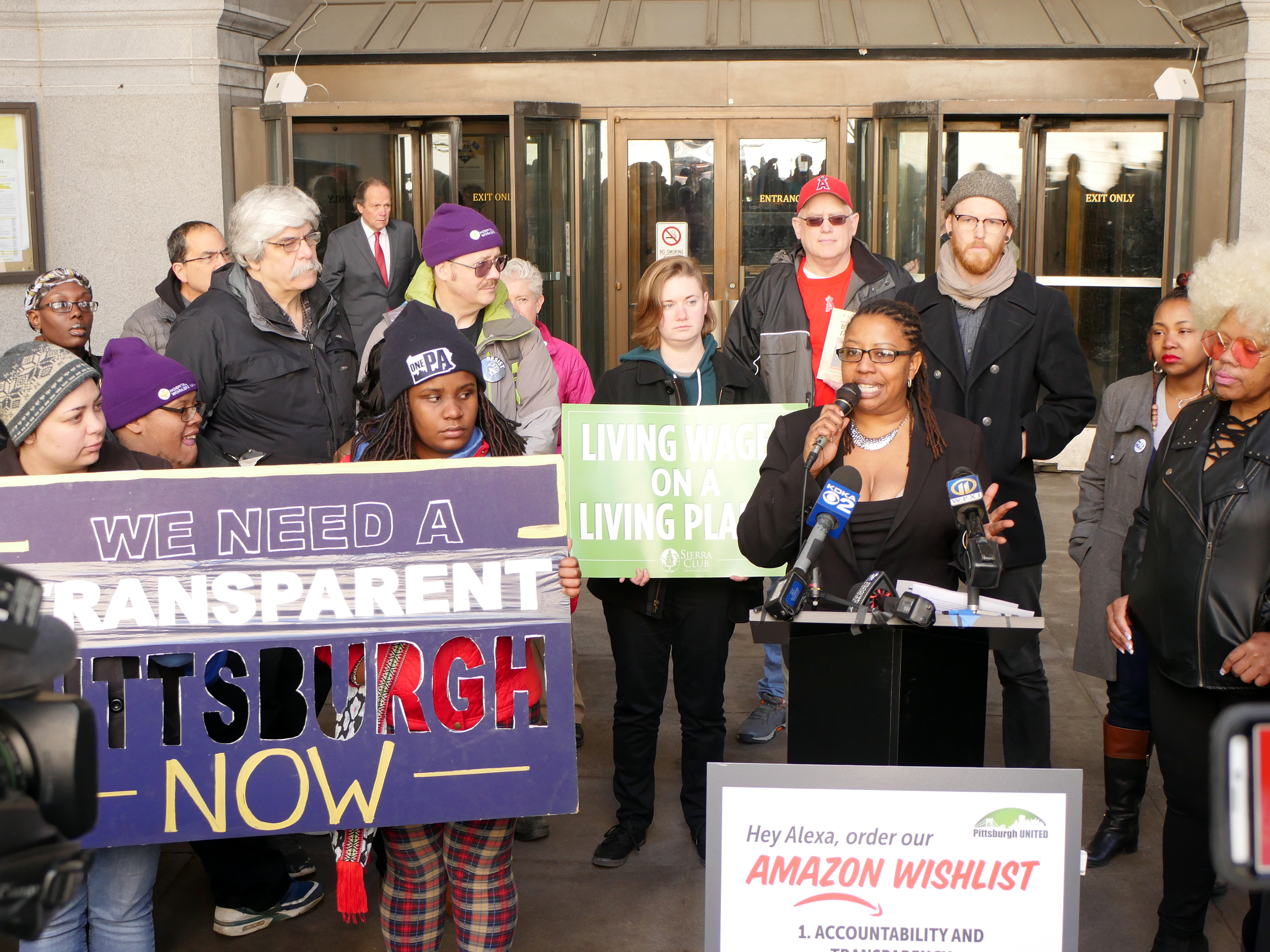 Brandi Fisher of Pittsburgh United speaks at a rally demanding more transparency in HQ2 bid, April 11, 2018.
